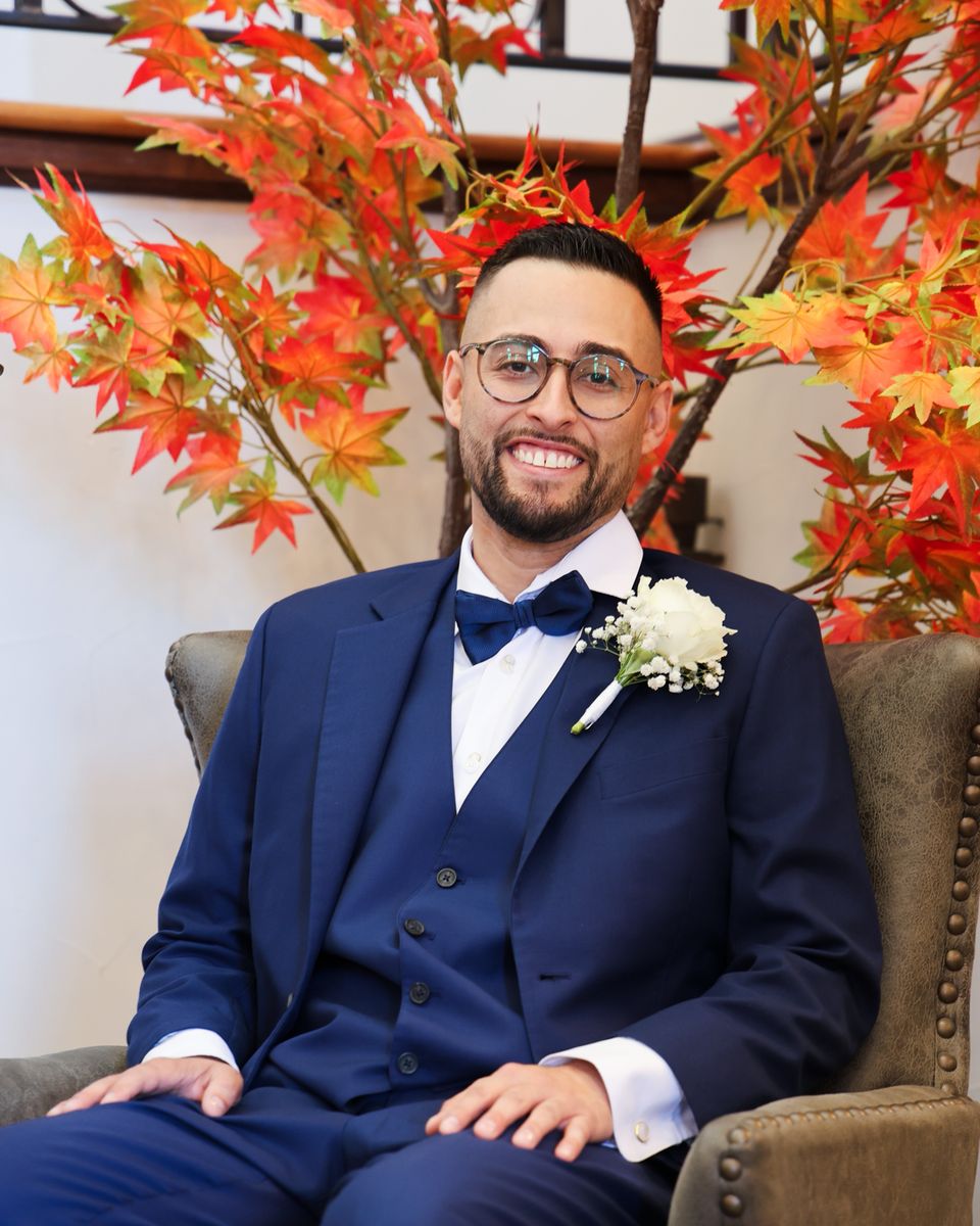 David Quintana, owner of Servicios Quintana LLC, seated in a navy suit